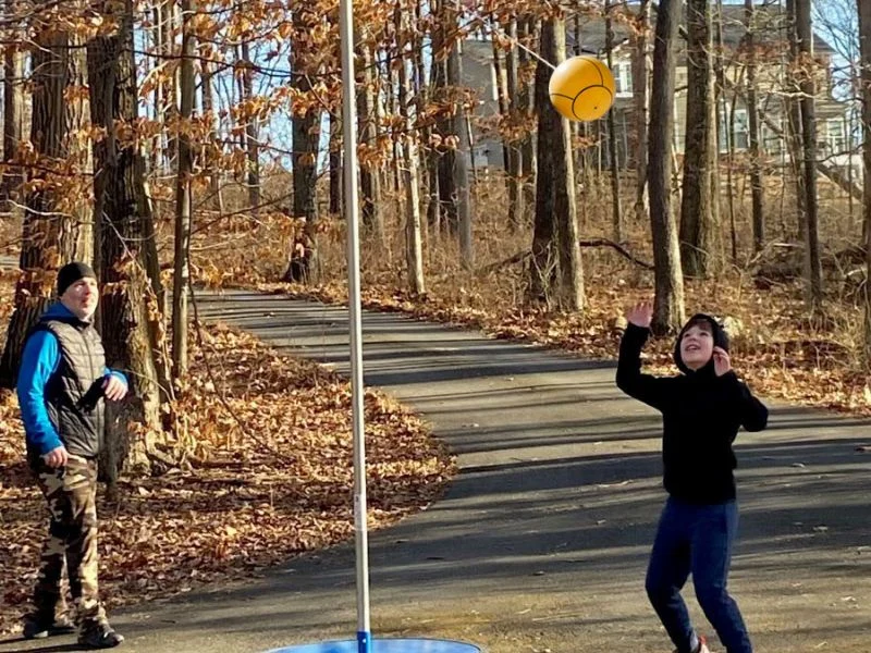 Tetherball wrapping around pole under impact