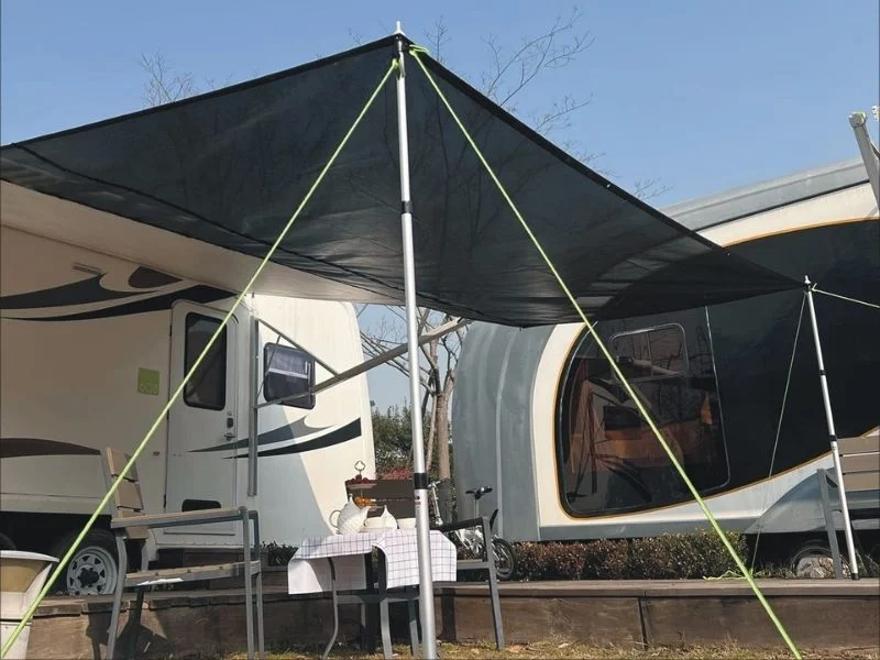 RV awning stabilizer pole on site