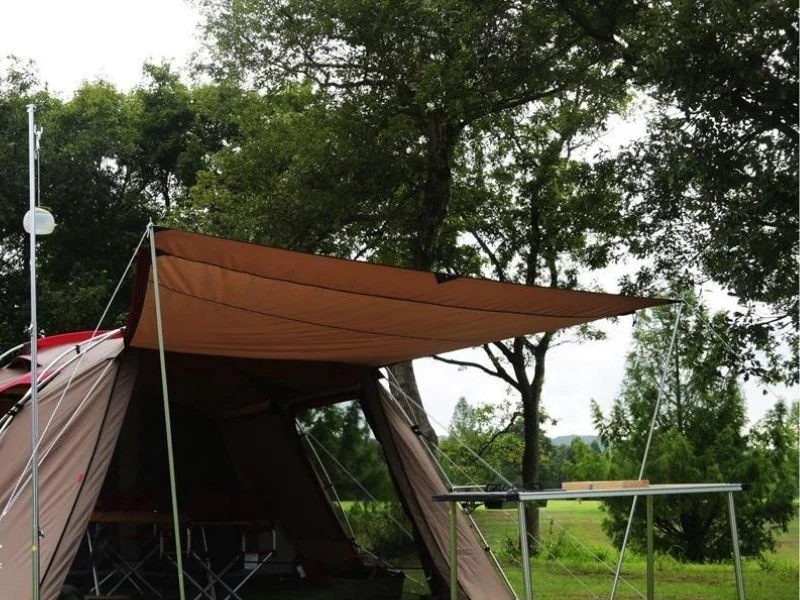 Spring tip and saddle on canvas awning pole