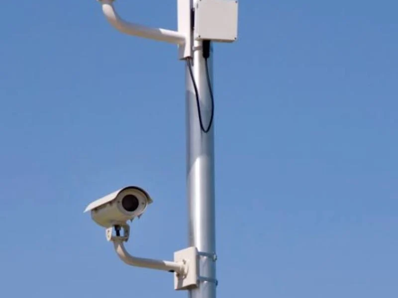 Two aluminum camera mast sections cut open to compare wall thickness