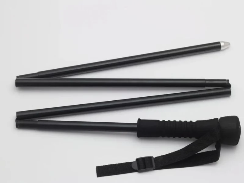 Folding wading staff packed beside deployed length