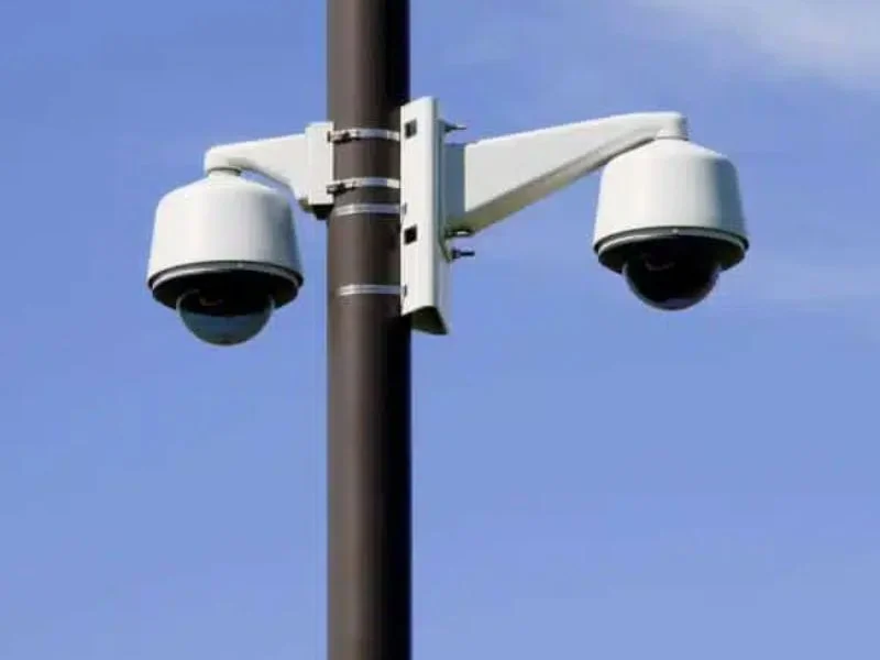 Machined top plate on an anodized aluminum camera pole with a dome camera bolted square